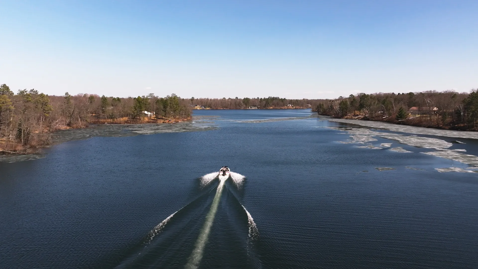 boat approaching ice sheets