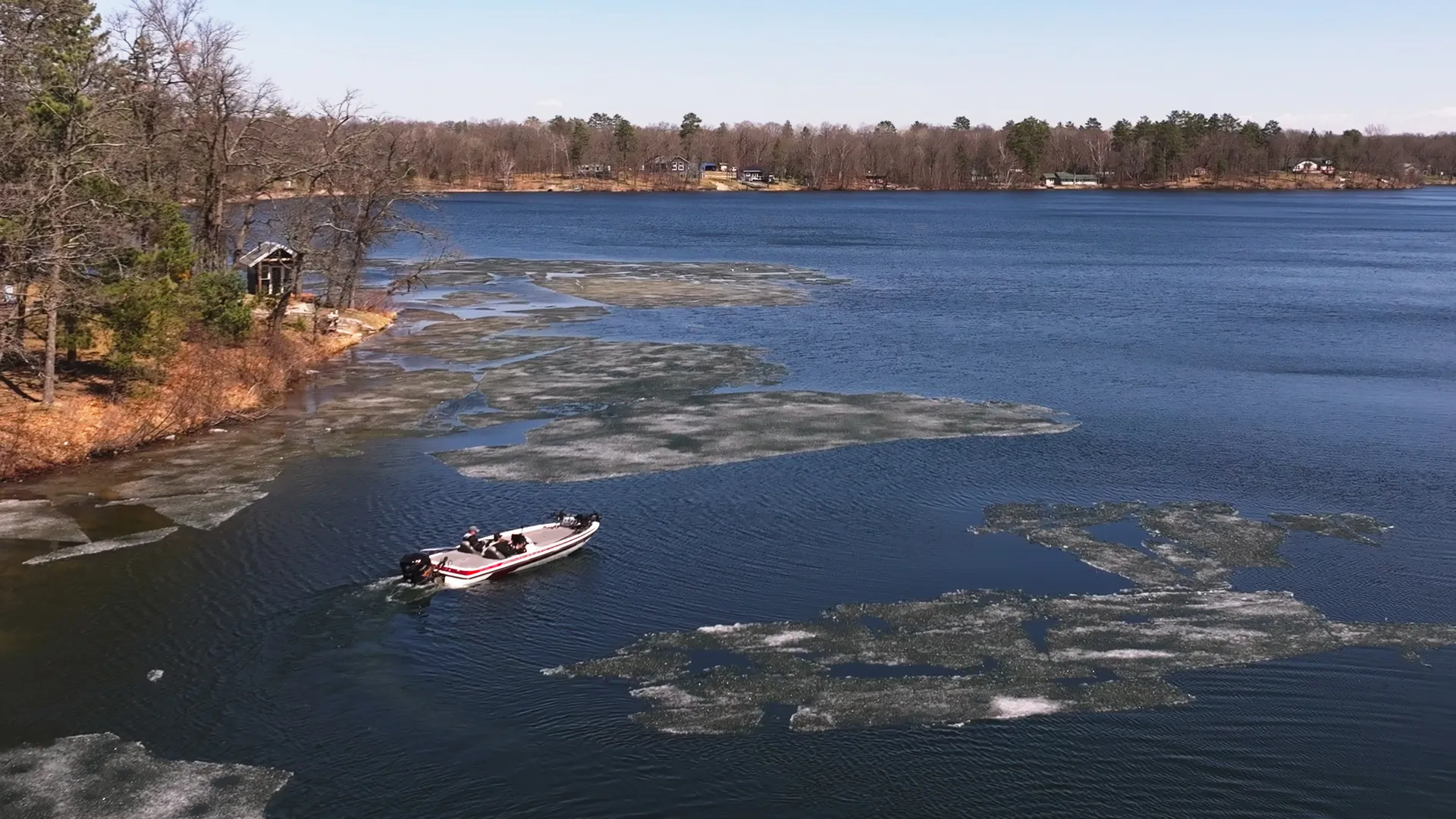 bass boat navigating ice sheets