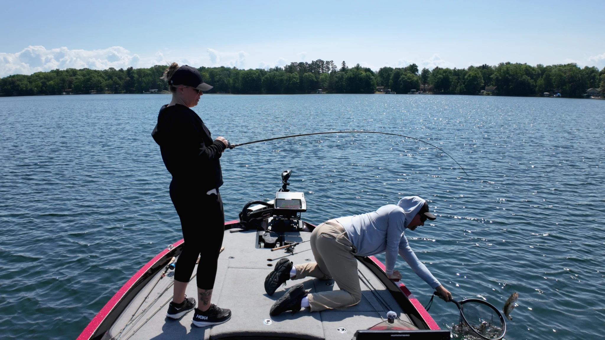 rayne catching a fish in net